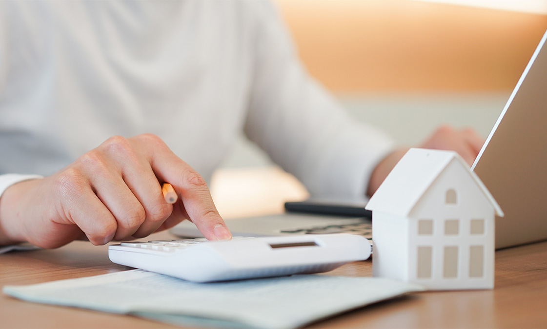 Man calculating his Adjustable Rate Mortgage