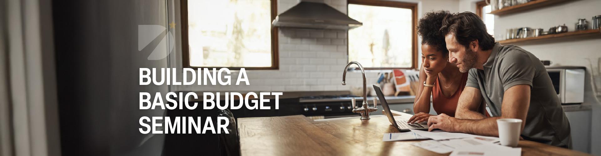 A couple builds a budget at the kitchen table
