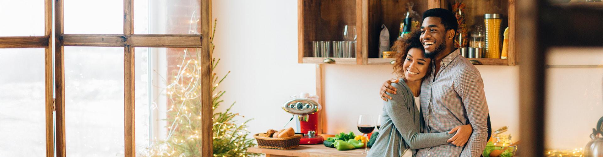 Happy couple in kitchen winter scene